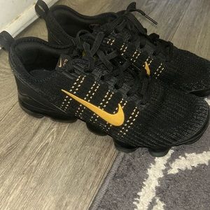 Black & gold Nike